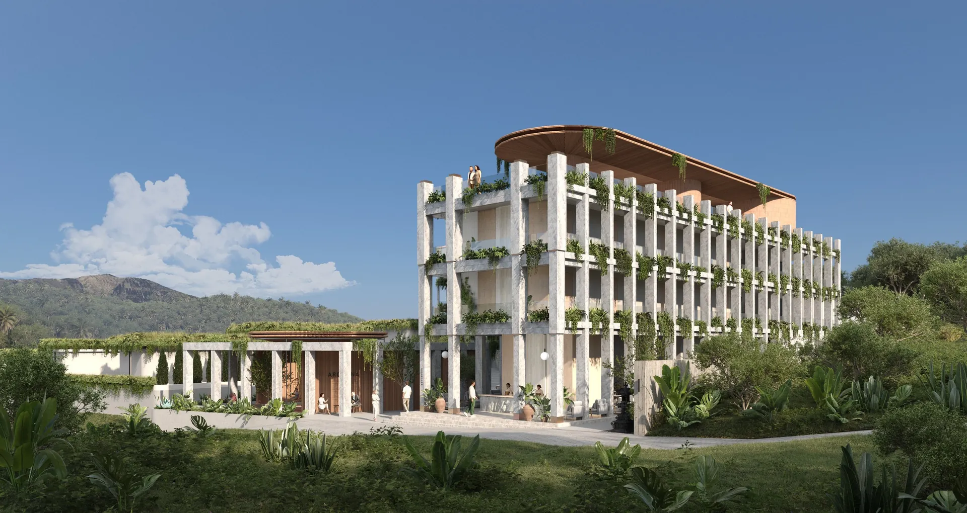 Ardhana hotel from the approach road, hills behind